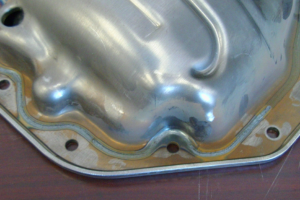 Fiber coupled diode laser welded nested automotive pan